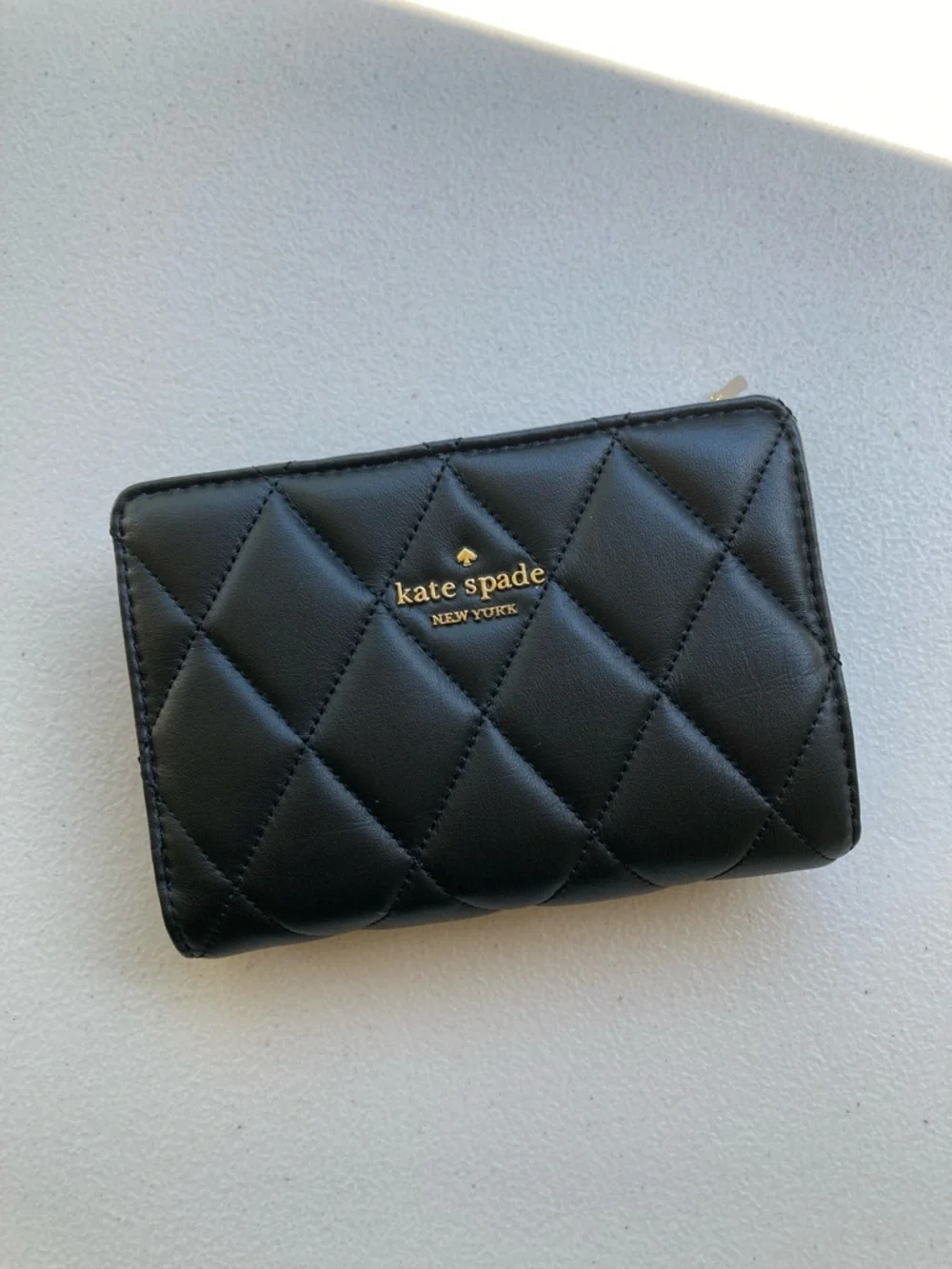 Kate Spade New York Carey Medium Compact Bifold Wallet in Black Quilted Leather
